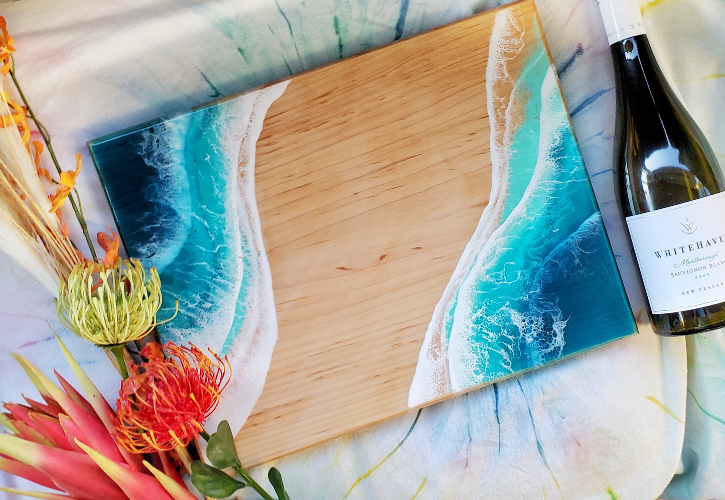 light wood board with turquoise waves